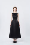 model in a black boat-neck A-line midi dress, DeTHEIA