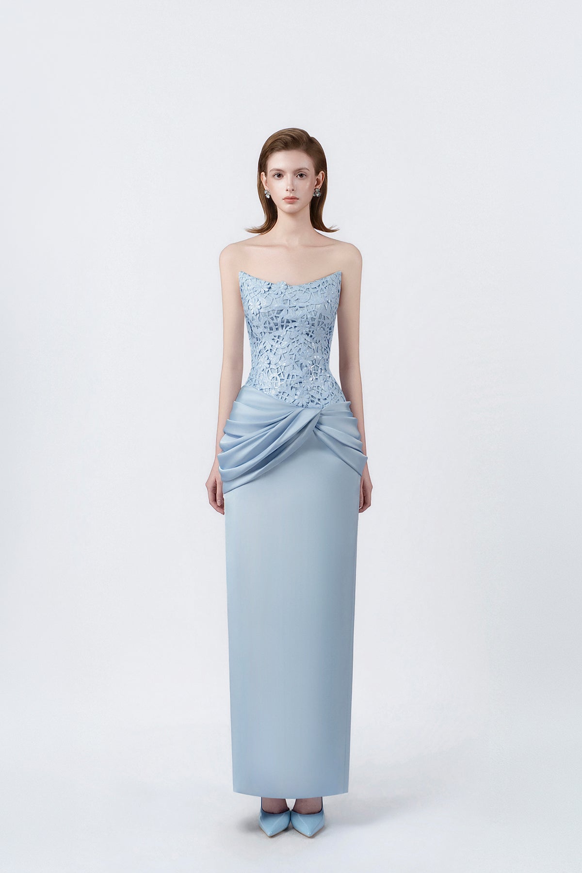 model in a light-blue strapless ruched pencil midi dress, DeTHEIA