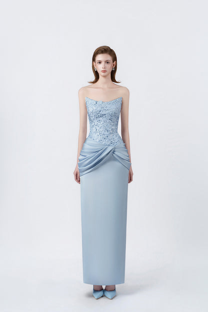 model in a light-blue strapless ruched pencil midi dress, DeTHEIA