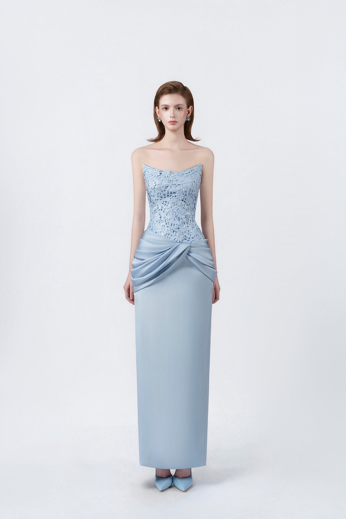 model in a light-blue strapless ruched pencil midi dress, DeTHEIA