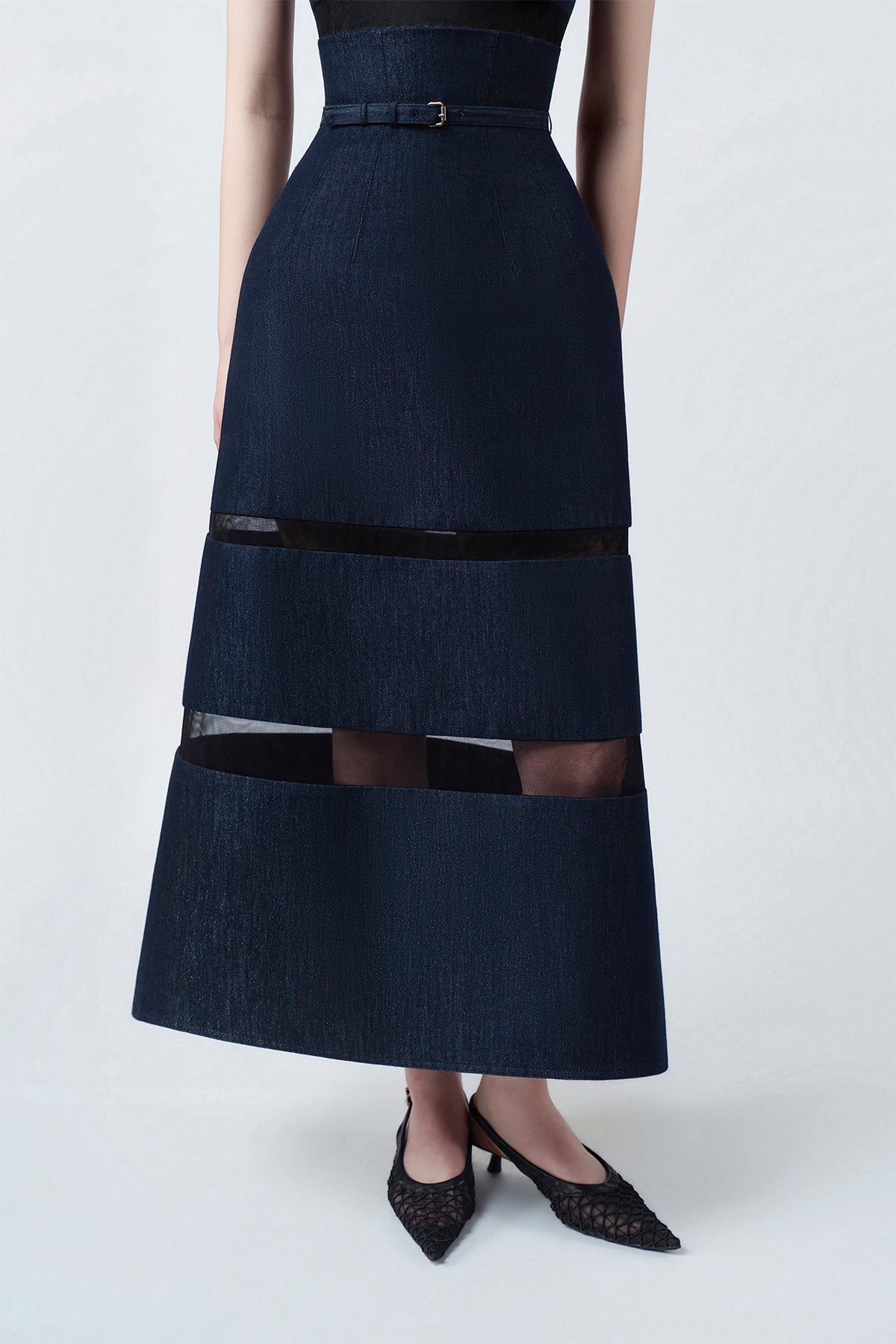 flared embroidered hem of the denim-blue midi dress, DeTHEIA