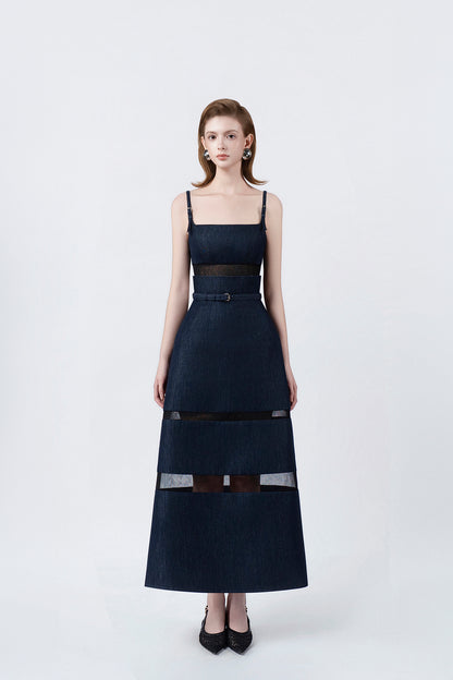 model in a denim-blue A-line midi dress with slim straps and belt, DeTHEIA