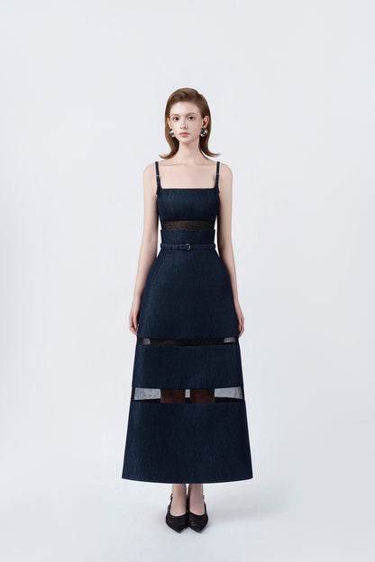 model in a denim-blue A-line midi dress with slim straps and belt, DeTHEIA