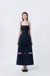 model in a denim-blue A-line midi dress with slim straps and belt, DeTHEIA