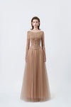model in a nude boat-neck long-sleeve lace maxi dress, DeTHEIA