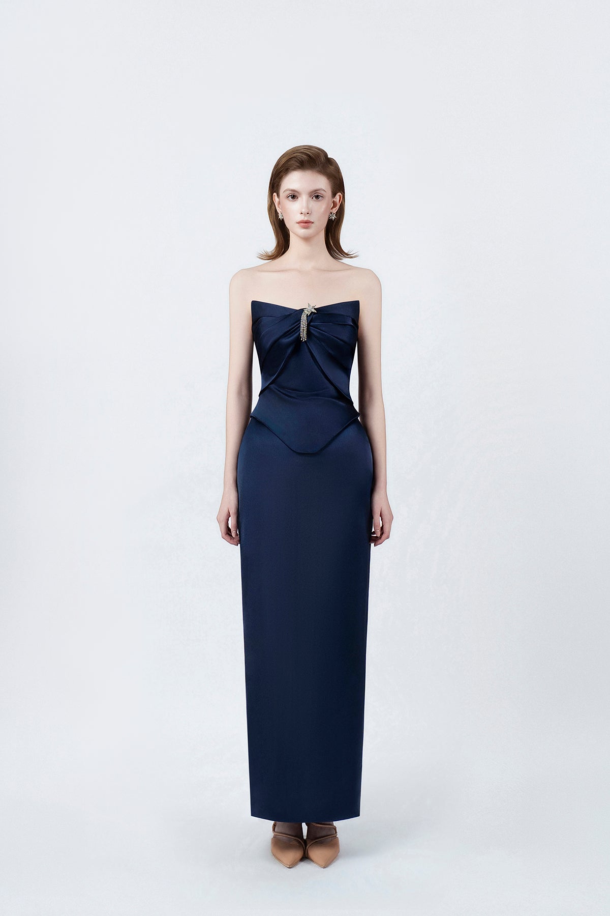 model in a navy strapless sweetheart pencil midi dress, DeTHEIA