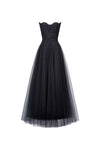 Black evening gown with floral lace bodice on a white background
