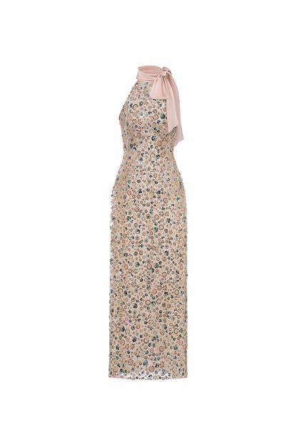 Floral dress with a halter neck and pink tie on a white background