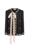 Black tweed jacket with a cream ribbon on a white background