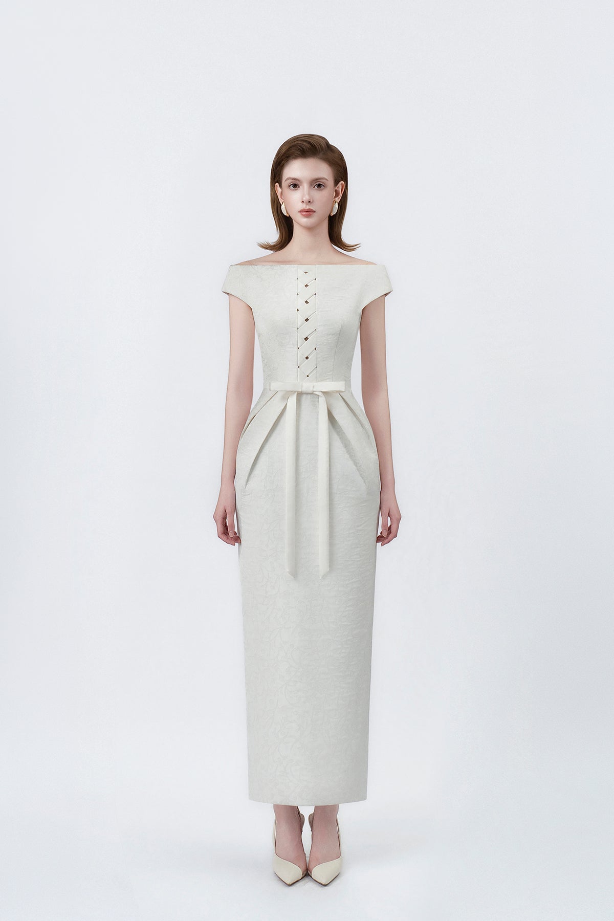 model in an ivory boat-neck pencil midi dress, DeTHEIA
