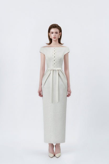 model in an ivory boat-neck pencil midi dress, DeTHEIA