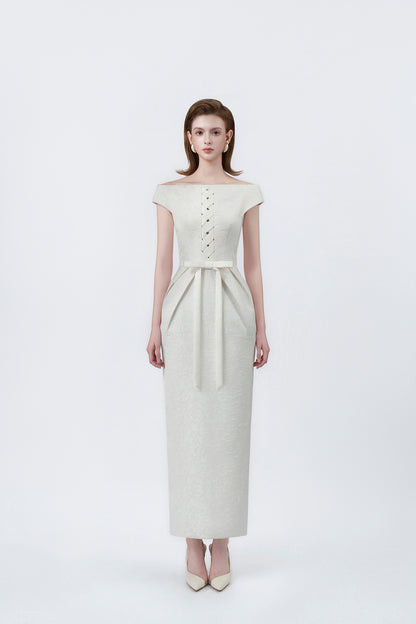 model in an ivory boat-neck pencil midi dress, DeTHEIA