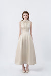 model in a beige ruffle-collar flared midi dress, DeTHEIA
