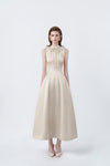 model in a beige ruffle-collar flared midi dress, DeTHEIA