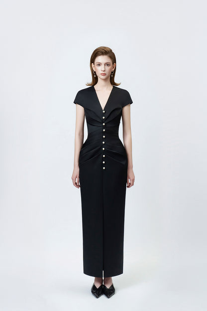 model in a black V-neck pencil midi dress, DeTHEIA