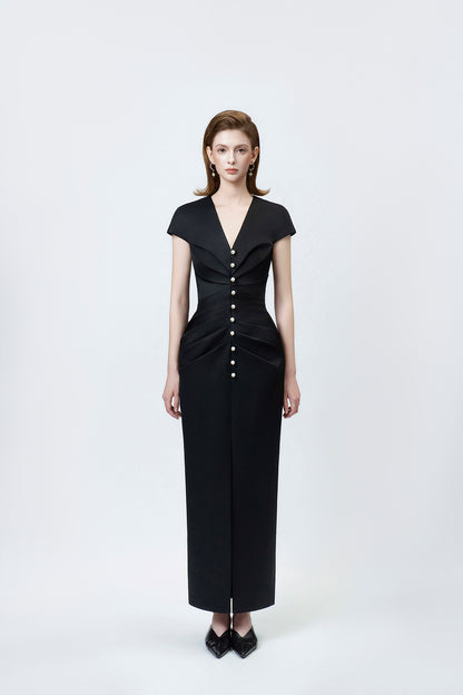 model in a black V-neck pencil midi dress, DeTHEIA