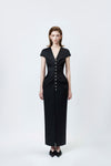 model in a black V-neck pencil midi dress, DeTHEIA