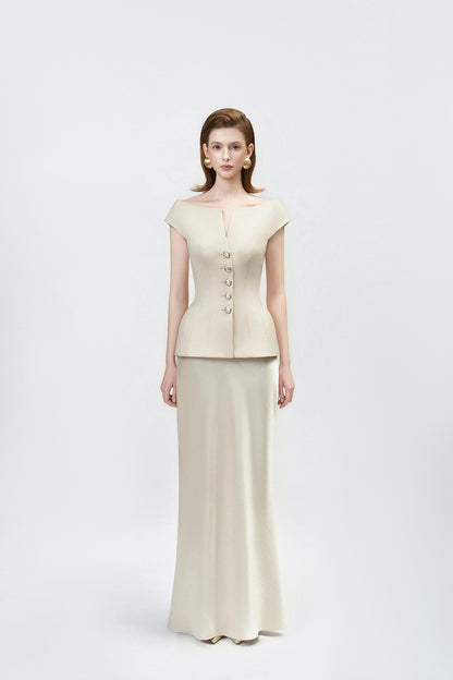 model in a gold high-waisted trumpet skirt, DeTHEIA