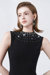black A-line midi dress with embellished neckline, DeTHEIA
