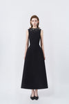 model in a black rhinestone-neckline A-line midi dress, DeTHEIA