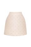 Beige skirt with small black polka dots on a white background